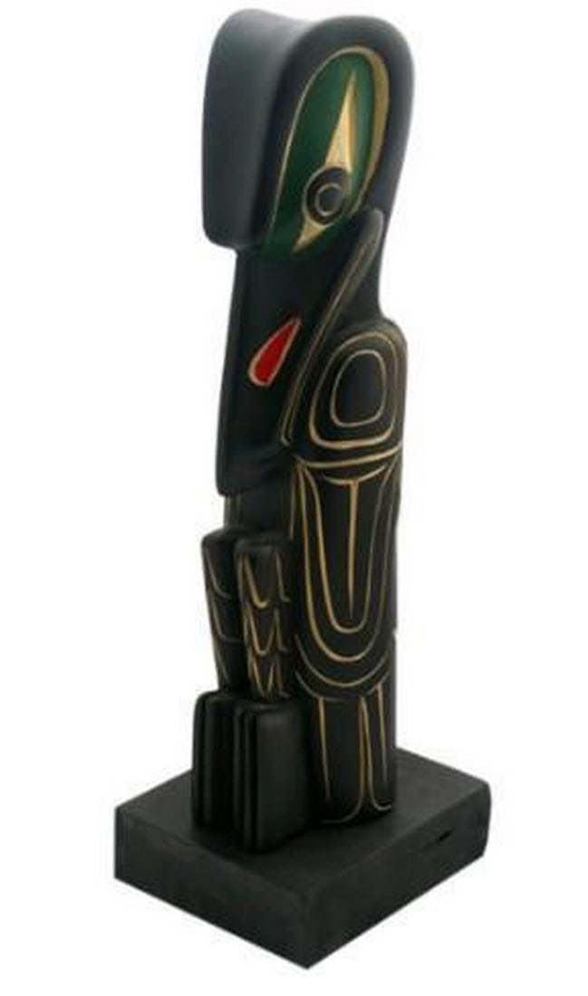 Mystic Bond Wooden Sculpture: Mystic Bond Wooden Sculpture This sculpture is carved all around and has a frog crest on its back. The raven is considered to be a trickster, cunning, intelligent, curious, mischievous and
