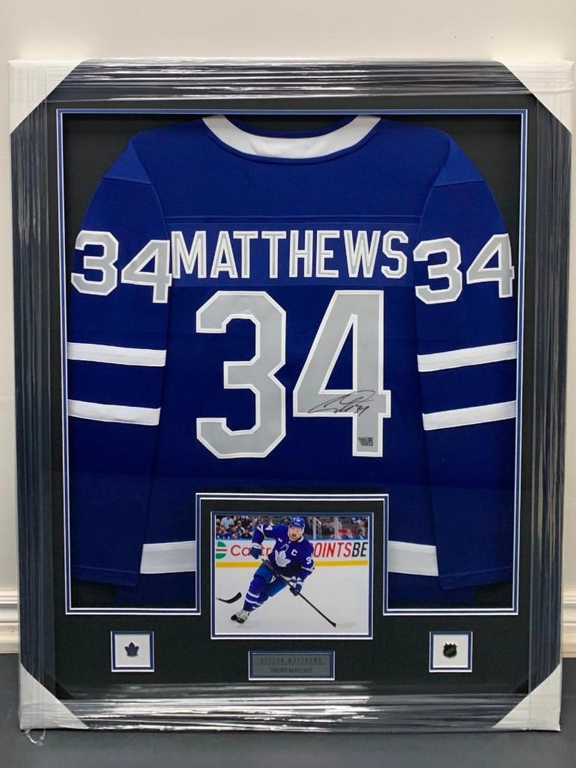 Framed Autographed Auston Matthews Toronto Fanatics Authenticated Jersey: Framed Autographed Auston Matthews Toronto Fanatics Authenticated Jersey. With Photograph, NHL Pin and Toronto Maple Leafs Pin. Player- Auston Matthews Size (with Fra
