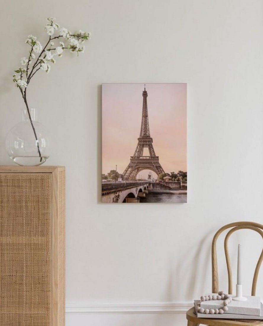 Parisian Twilight Canvas: Parisian Twilight Canvas This Parisian Twilight Canvas captures the enchanting glow of the Eiffel Tower against a soft, twilight sky. The fading light of day gently wraps the iconic landmark in