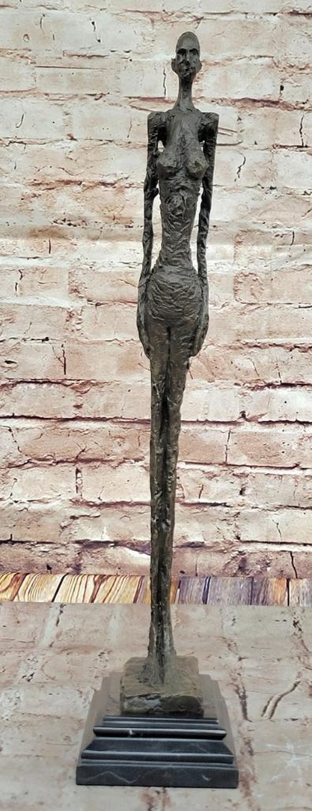Standing Tall Bronze Girl Figurine on Marble Base Giacometti Inspired - 19.5" x 5.5": Standing Tall Bronze Girl Figurine on Marble Base Giacometti Inspired - 19.5" x 5.5" Graceful in form and powerful in presence, this bronze figurine of a standing girl captures strength throu