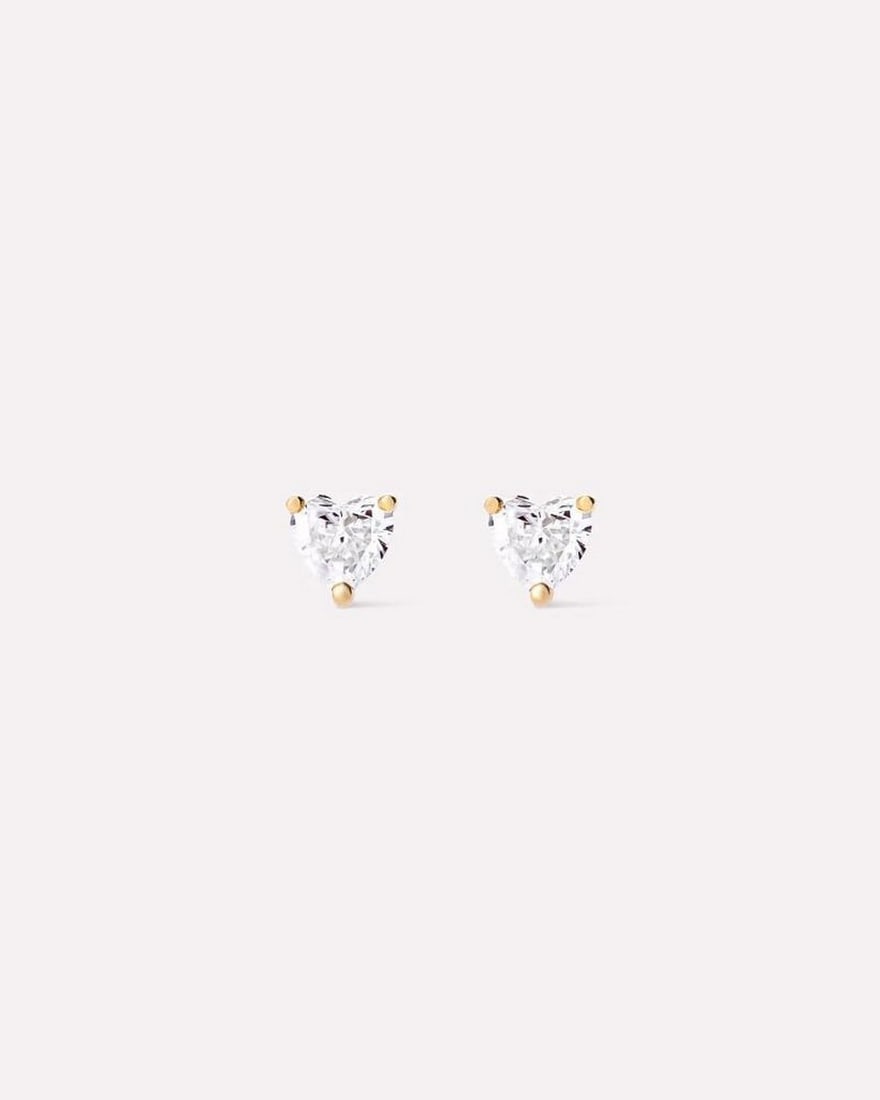 Solid Gold Heart Stud Earrings: Solid Gold Heart Stud Earrings These earrings are crafted from recycled solid yellow gold and feature heart-shaped lab-grown diamonds. Designed for durability, they are resistant to water and