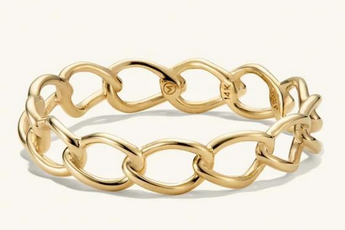 14K Gold Woven Braid Ring: 14K Gold Woven Braid Ring Intricately woven strands of 14K gold form this elegant braided band, symbolizing unity, strength, and timeless beauty. The soft curves and polished finish give it a