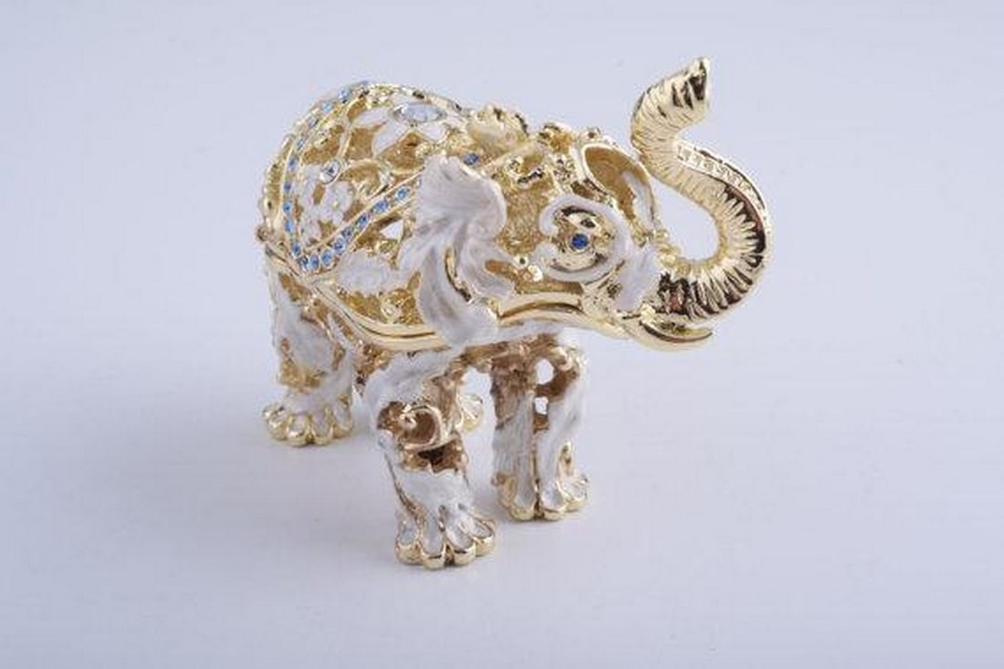 Golden Elephant Trinket Box: Golden Elephant Trinket Box Enamel painted trinket box decorated with austrian crystals. A charming handmade golden elephant trinket box. This piece is a unique one of a kind piece made for art lovers