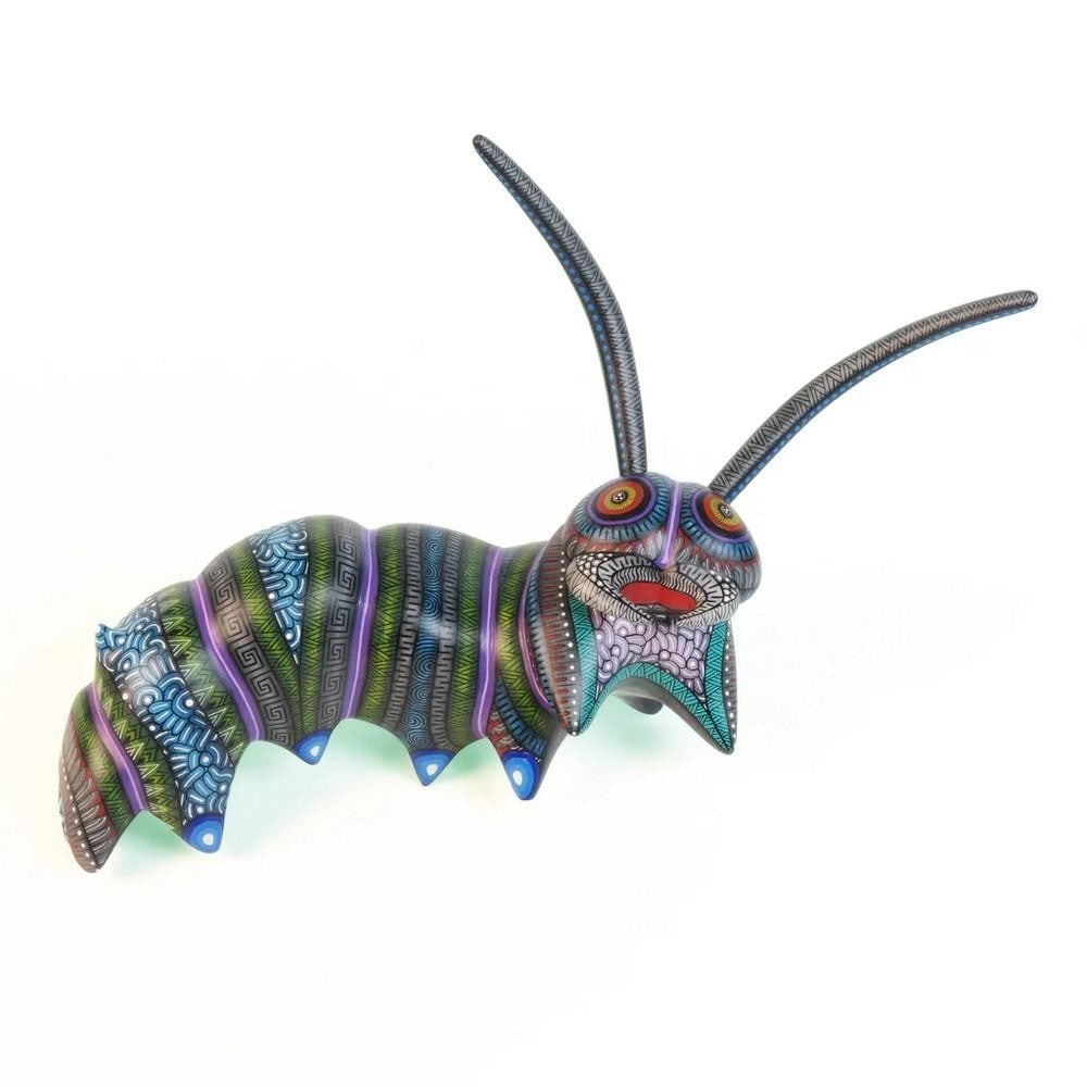 Zapotec Elegance: Handcrafted Caterpillar Alebrije from Arrazola: Zapotec Elegance: Handcrafted Caterpillar Alebrije from Arrazola Bursting with intricate detail and vibrant color, this stunning caterpillar alebrije is a testament to the craftsmanship of the Morales
