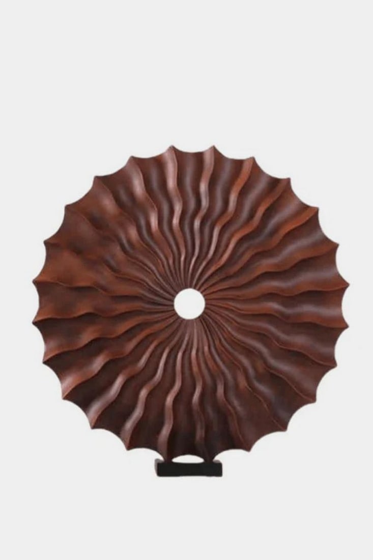 Spiral Pulse – Handcarved Wooden Sculpture: Spiral Pulse – Handcarved Wooden Sculpture A mesmerizing interplay of geometry and nature, Spiral Pulse captures the organic elegance of hand-carved wood in a radiating circular form. Crafted