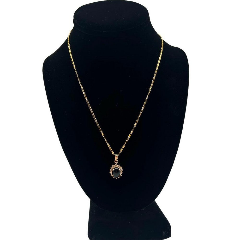 Black Onyx Center Stone CZ Pendant Necklace: Black Onyx Center Stone CZ Pendant Necklace At the heart of the pendant lies a lustrous black onyx stone, renowned for its deep black hue and smooth, polished surface. The onyx stone is expertly