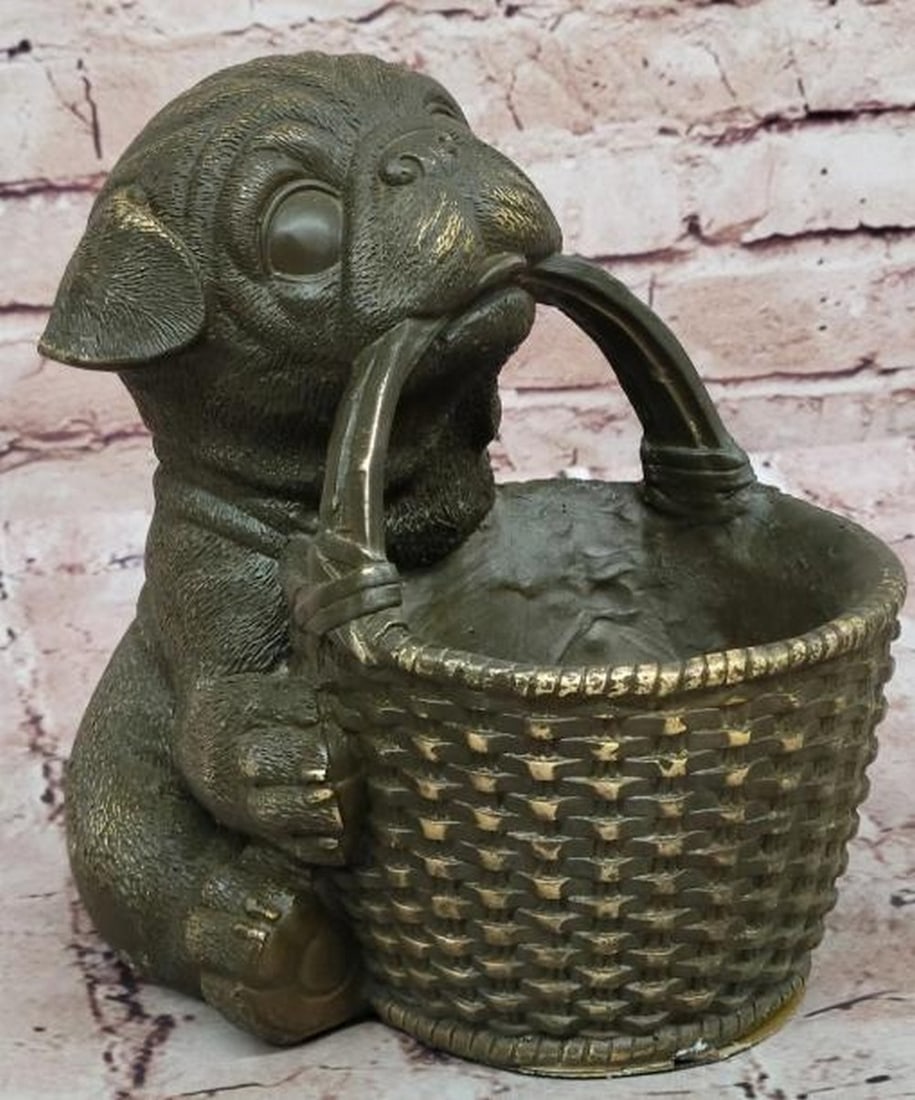 Loyal Companion: Bronze Pug Puppy with Basket: Loyal Companion: Bronze Pug Puppy with Basket Full of charm and character, this endearing bronze sculpture features a delightful pug puppy holding a finely detailed woven basket in its mouth. From th