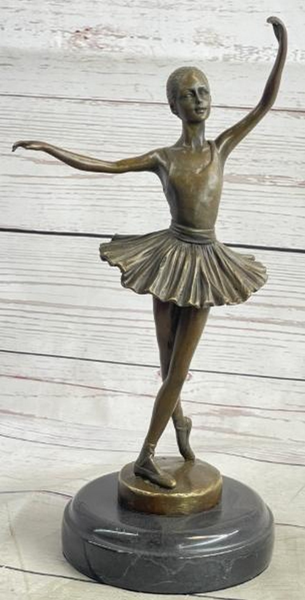 Grace in Bronze: Ballet Dancer Sculpture: Grace in Bronze: Ballet Dancer Sculpture This exquisite bronze sculpture captures the poise and elegance of a ballet dancer frozen mid-pose, her slender form draped in a traditional ballet uniform