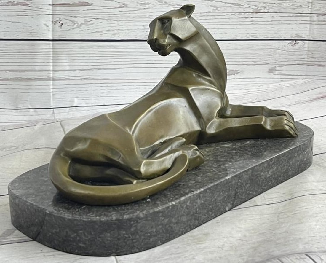 Silent Watch Bronze Sculpture: Silent Watch Bronze Sculpture This elegant bronze sculpture, bearing the signature of artist H. Moore, presents a stylized cougar in repose. The feline's body is rendered in soft geometric forms,