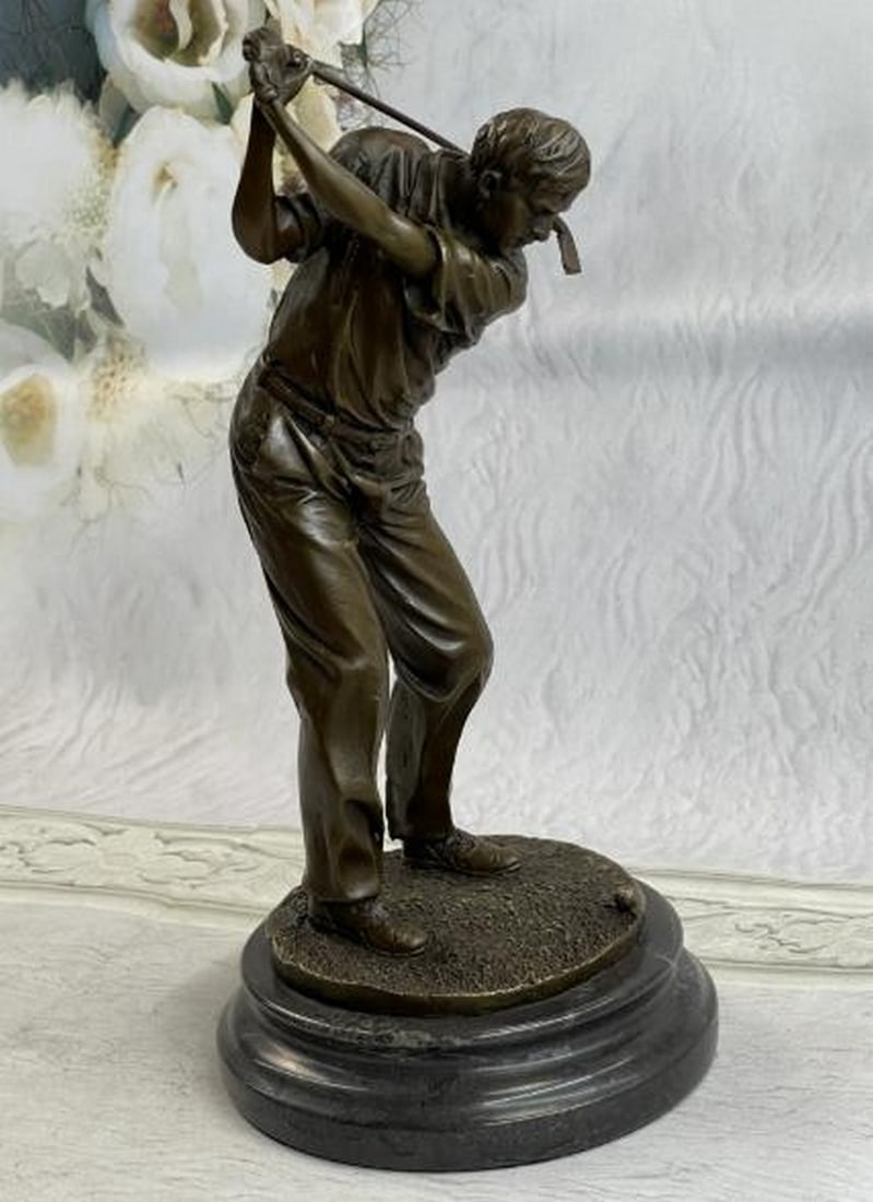The Perfect Swing Bronze Sculpture: The Perfect Swing Bronze Sculpture This dynamic bronze sculpture, bearing the signature of artist Milo, captures a male golfer in the powerful moment of a mid back swing, poised, focused, and ready t