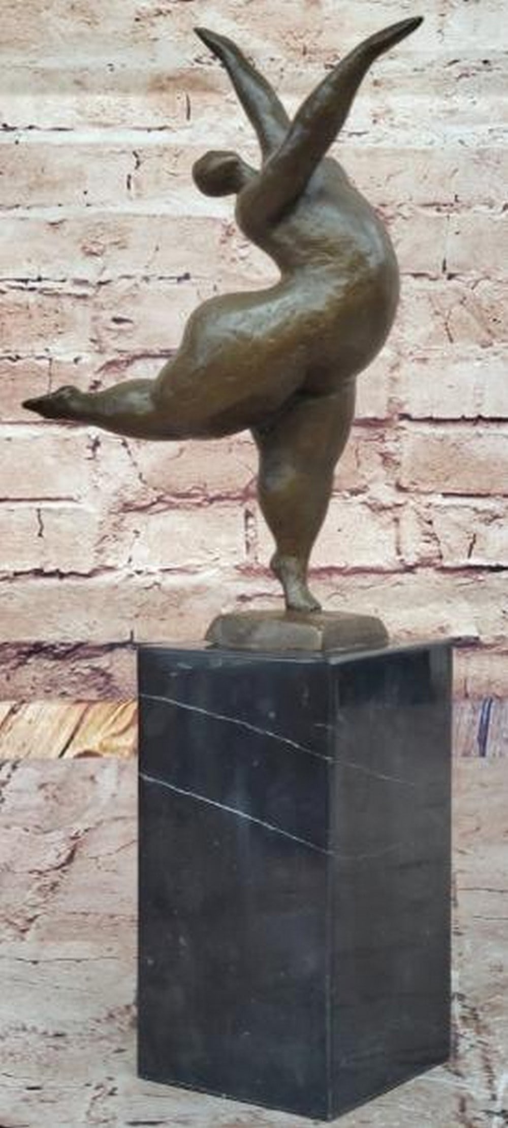 Ethereal Motion Abstract Nude Dancer: Ethereal Motion Abstract Nude Dancer A celebration of movement and form, this is an abstract bronze sculpture of a curvy nude female dancer, capturing the fluidity of the human body in a minimalist,