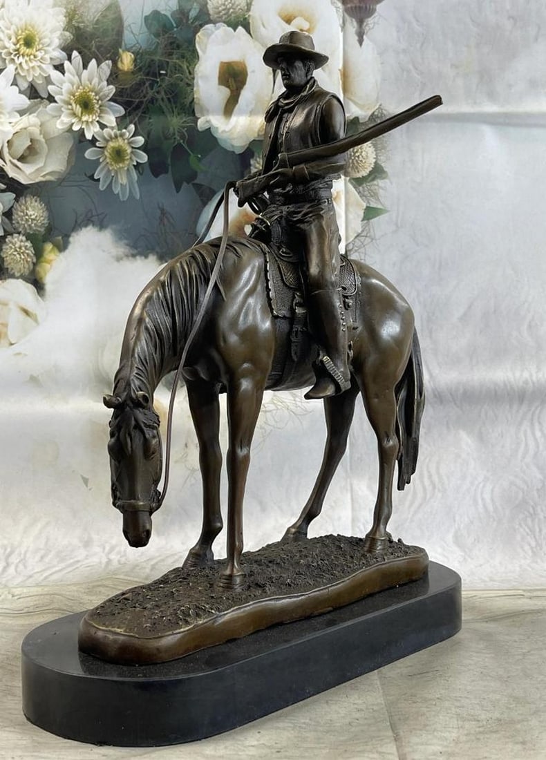 Western Cowboy on Horseback w/ Shotgun Bronze Sculpture - 16" x 14": Western Cowboy on Horseback w/ Shotgun Bronze Sculpture - 16" x 14" Experience the thrill of the Wild West with this stunning bronze sculpture depicting a cowboy charging across the dry land