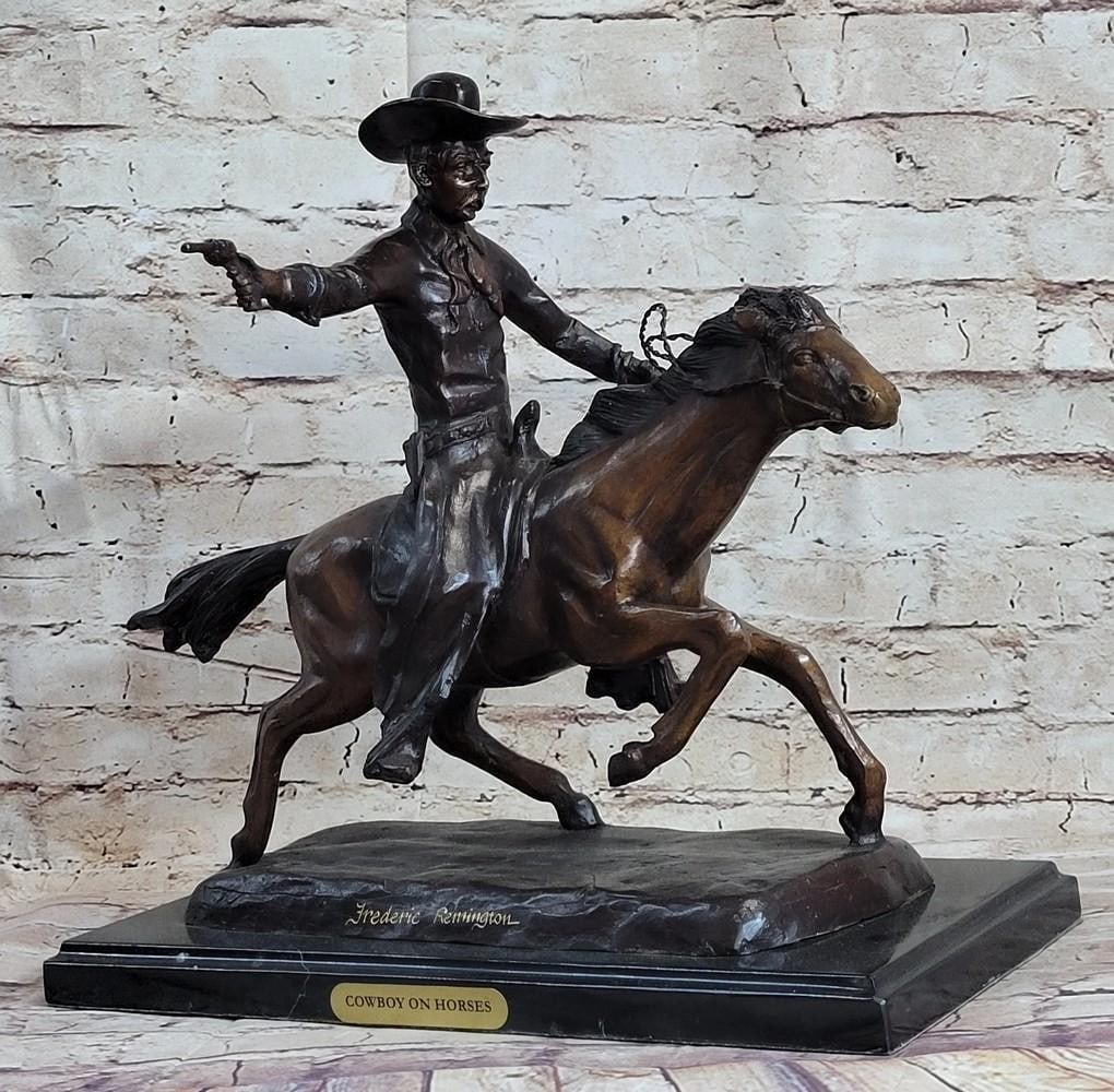 Cowboy on Horse Western Bronze Sculpture - 15" x 18": Cowboy on Horse Western Bronze Sculpture - 15" x 18" A cowboy charges across the dry land with his gun in the air. His horse gallops, with its nose pointed forward. The cowboy holds the reins