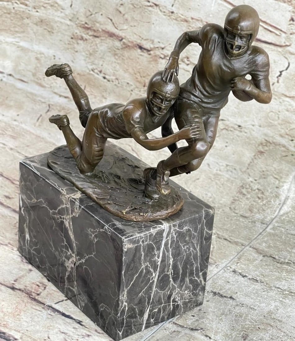 Fierce Football Players Bronze Sculpture - 9" x 7": Fierce Football Players Bronze Sculpture - 9" x 7" This stunning bronze sculpture depicts two muscular football players sprinting towards the end zone, dodging defenders and fighting for vict