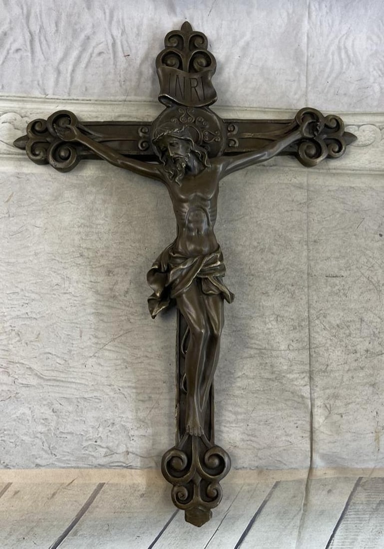 Wall Mount Hanging Bronze Crucifix Sculpture: Wall Mount Hanging Bronze Crucifix Sculpture The sculpture of the crucified Christ was titled "The Jesus on the Cross" by the renowned English sculptor Valli. He wanted to portray Christ
