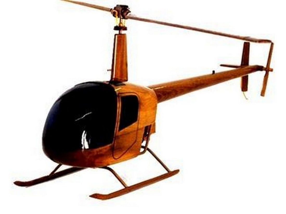 Robinson 22 Helicopter: Robinson 22 Helicopter Handcrafted from solid mahogany, this scale replica model of the Robinson 22 Helicopter has wonderful detail, high gloss and deep wood grain. Given multiple coats of