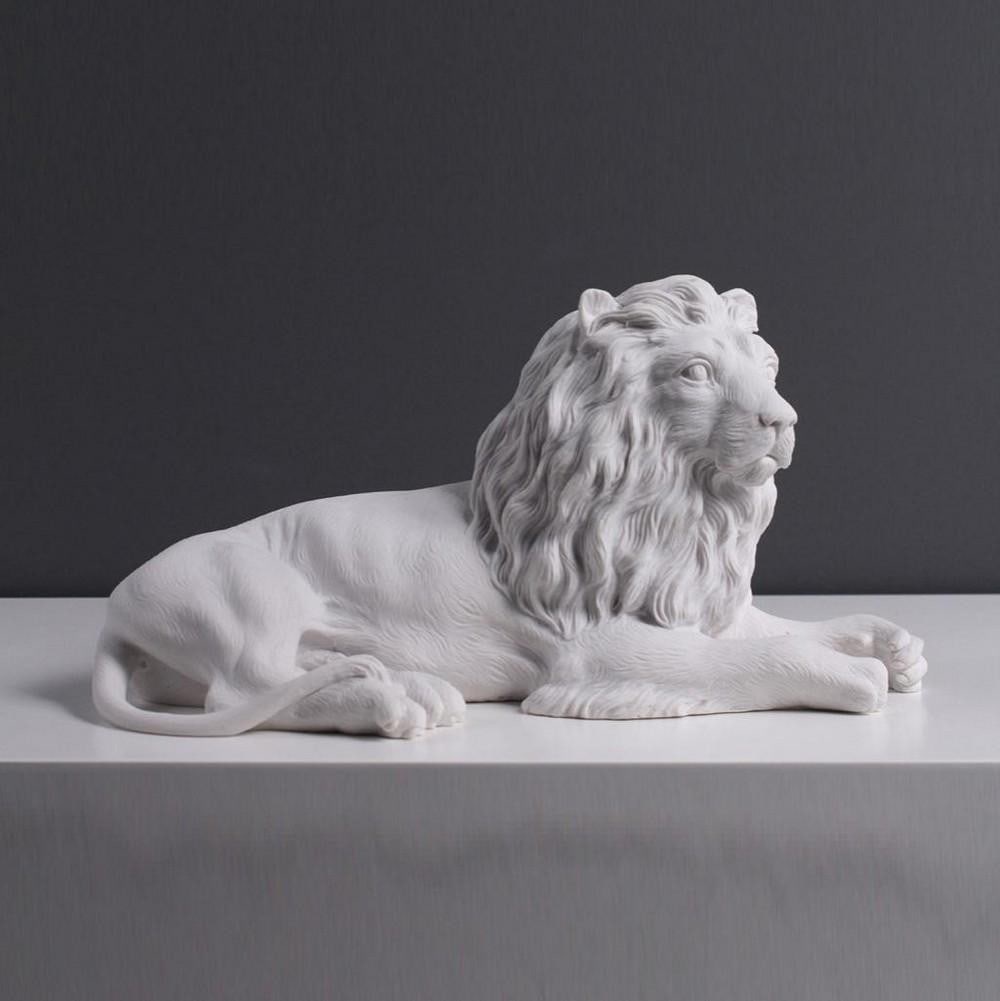 Muscular Lying Lion White Carrara Marble Sculpture - (4.2lbs): Muscular Lying Lion White Carrara Marble Sculpture - (4.2lbs) The Lying Lion Statue showcases a muscular and deep-chested body, complemented by a rounded head and ears. The statue also features a