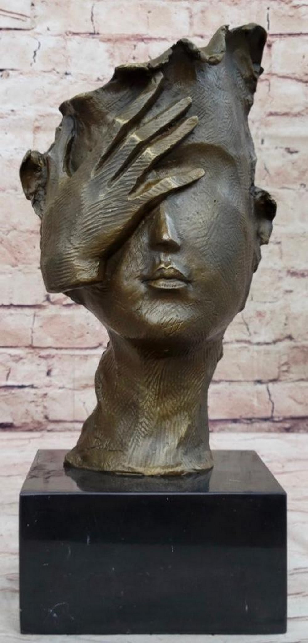 Surreal Visage Abstract Bronze Bust with Hand Veiling Half Face - 15" x 7": Surreal Visage Abstract Bronze Bust with Hand Veiling Half Face - 15" x 7" The sculpture portrays a figure with her right hand pressed gently against her face, exuding a sense of pain or disc