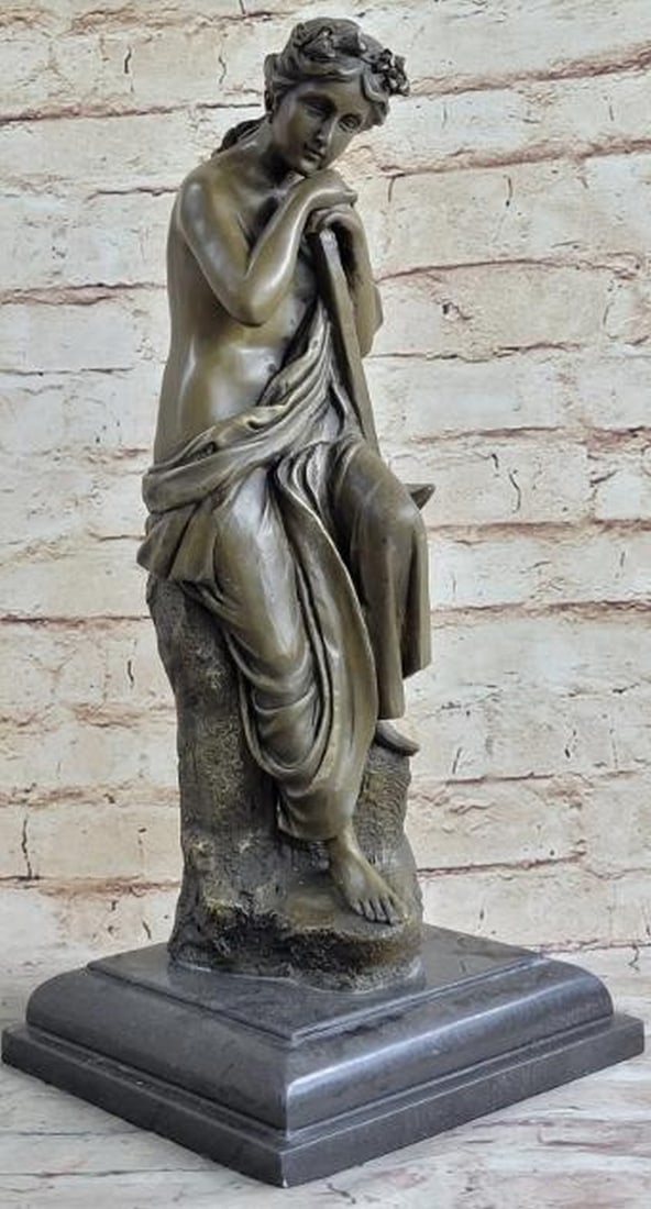 Hard Working Woman Resting on a Rock Bronze Sculpture: Hard Working Woman Resting on a Rock Bronze Sculpture The young woman sits pensively on a high rock. Her head rests on her hands as her gaze focuses downwards. She is dressed in the semi- nude. A gar