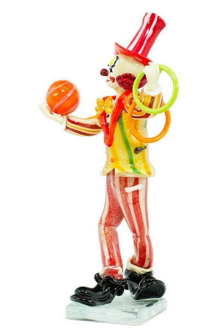 Dusty The Clown Murano Glass Figurine: Dusty The Clown Murano Glass Figurine This clown figurine features a clown in a striped hat and pants holding rings in one hand and a basketball in the other. Dimensions: 3.9"L x 5.9"W x 9.8