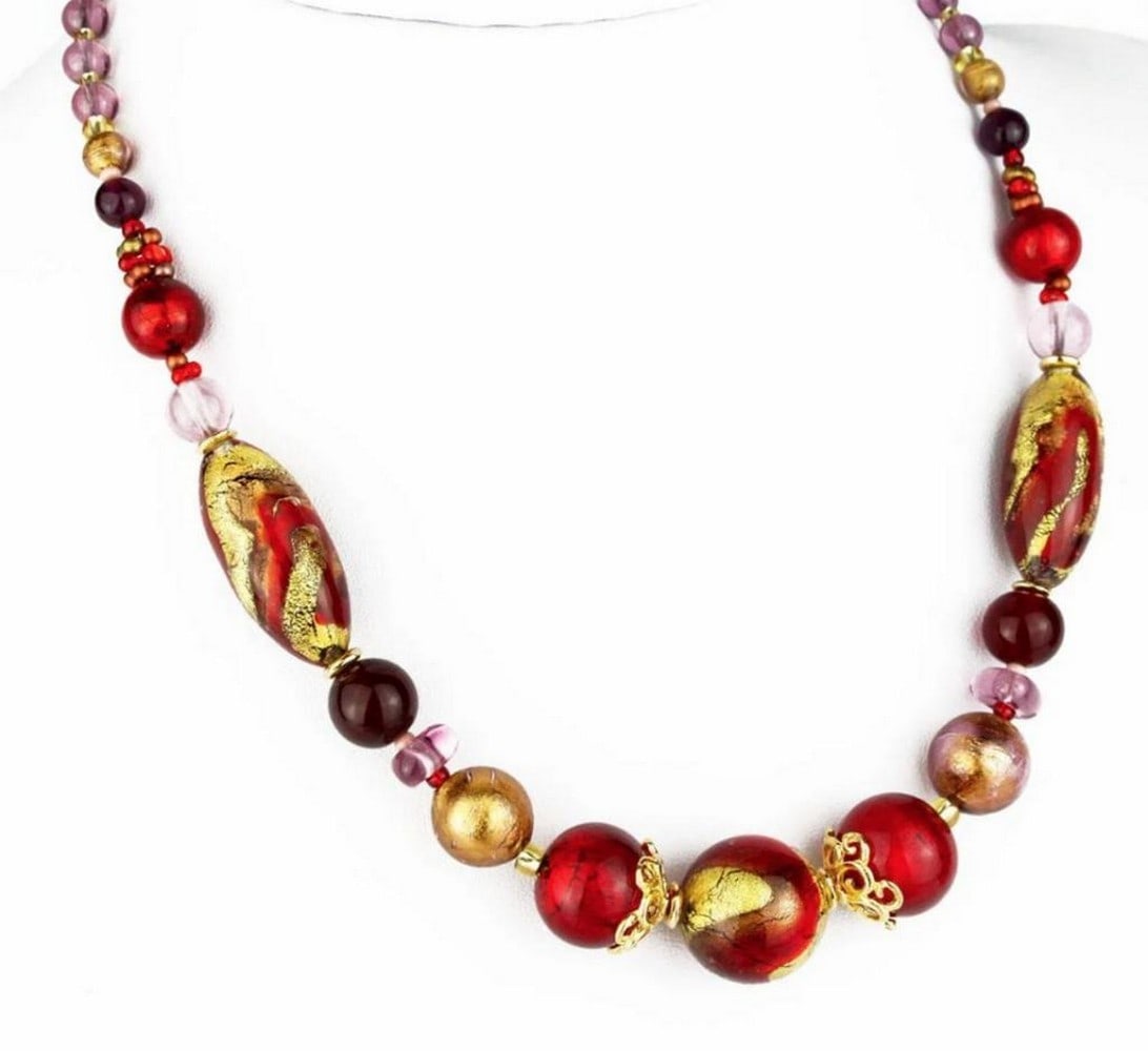 Aurelia Gold Toned Glass Beaded Necklace: Aurelia Gold Toned Glass Beaded Necklace This necklace is made in lamp working technique, and each bead is worked as single piece. Beads are made in molten glass, so this necklace is a perfect jewels