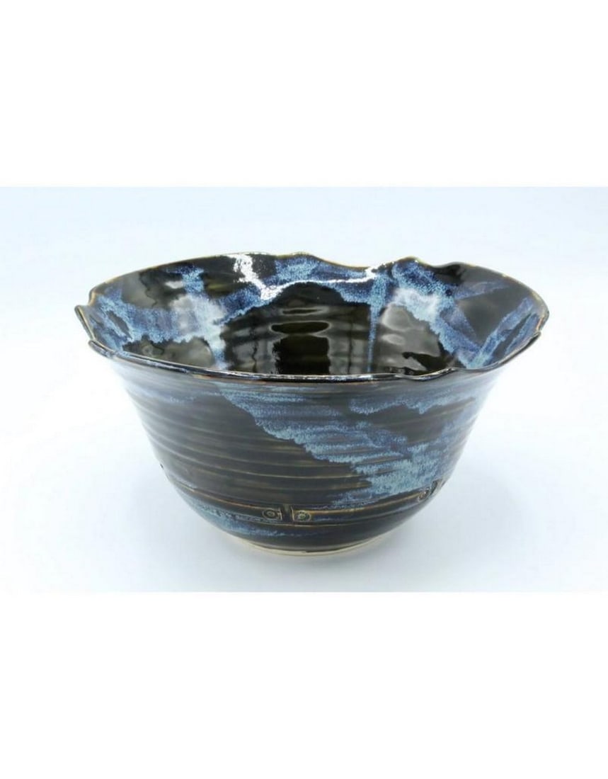 Charcoal Glaze Medium Serving Bowl: Charcoal Glaze Medium Serving Bowl A sleek and versatile medium serving bowl featuring a rich charcoal glaze. Perfect for serving salads, pasta, or side dishes, it adds a modern touch to any table