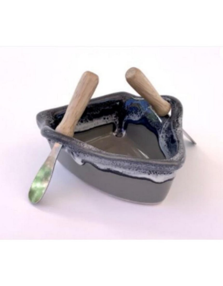Ricker Rock Ceramic Boat Dip Pot: Ricker Rock Ceramic Boat Dip Pot The Ricker Rock Ceramic Boat Dip Pot is a beautifully crafted piece with a unique boat shape and a textured finish that mimics the natural appearance of river