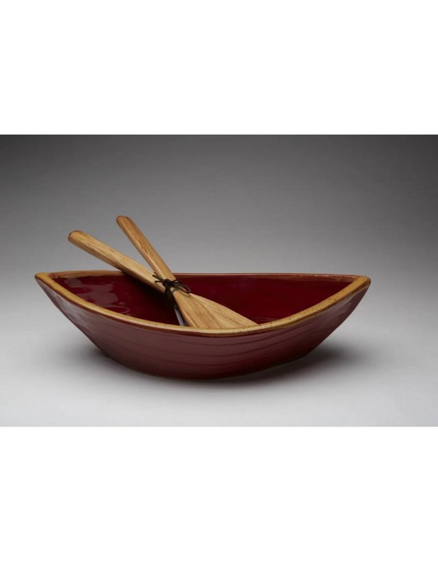 Red/Gold Ceramic Dory Serving Bowl: Red/Gold Ceramic Dory Serving Bowl The Red/Gold Ceramic Dory Serving Bowl combines elegance and charm with its striking red and gold accents. Inspired by the graceful shape of a dory boat, this bowl