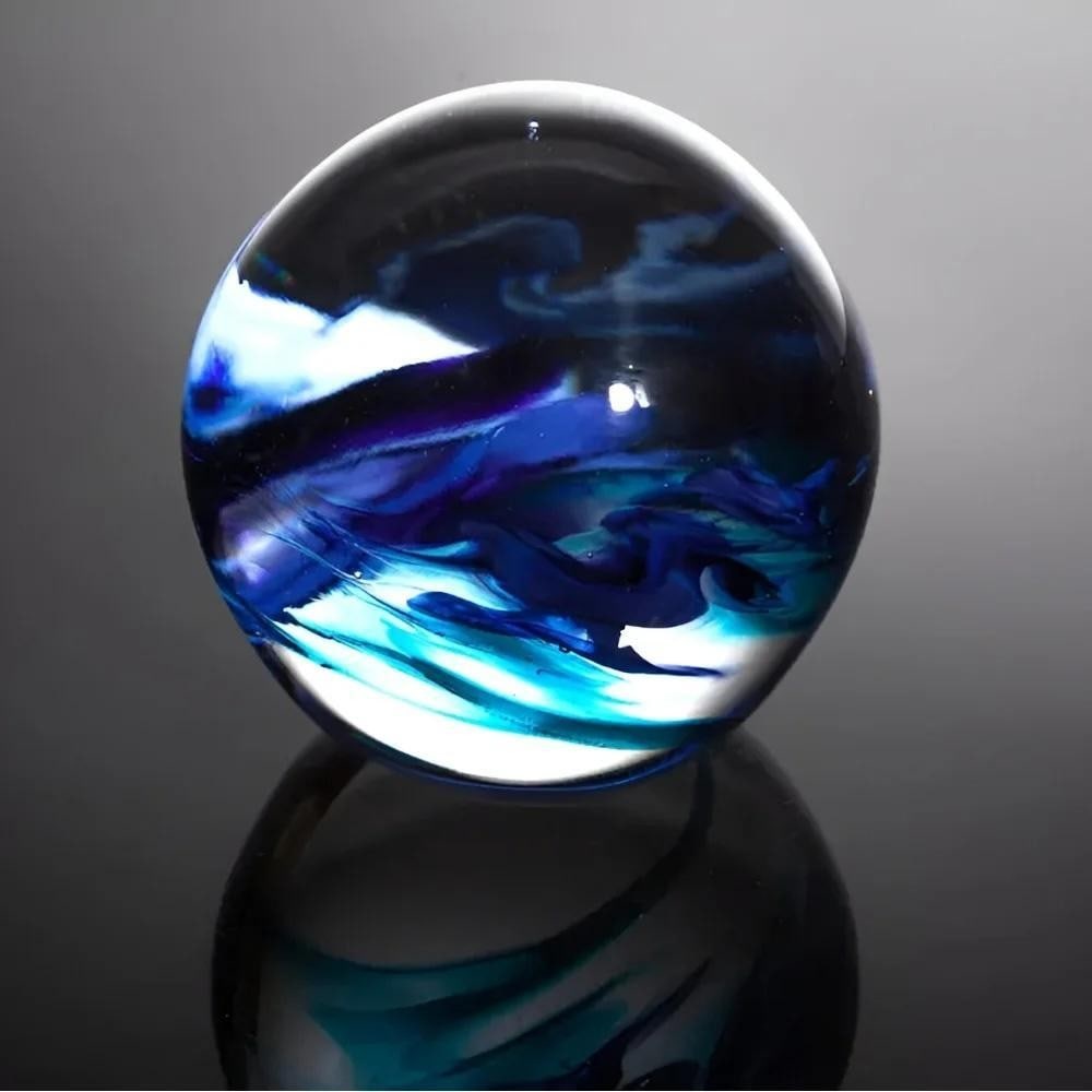 Round Glass Paperweights by Hayley Gammon: Round Glass Paperweights by Hayley Gammon Hand-blown glass paperweights by Hayley Gammon feature vivid swirls of colour encased in clear glass, with a smooth, polished surface that enhances their