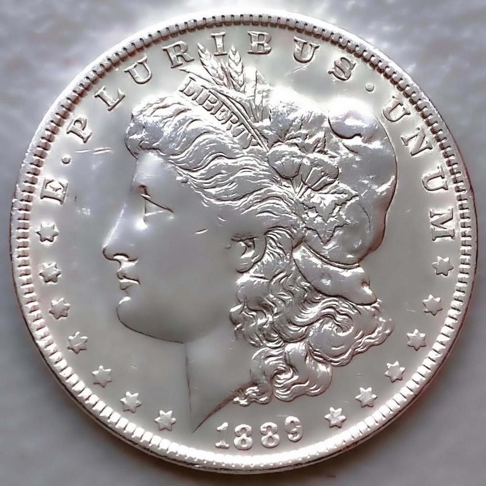 1889 AU MORGAN SILVER DOLLAR: 1889 AU MORGAN SILVER DOLLAR Certification: Uncertified Circulated/Uncirculated: Circulated Year: 1889 Composition: 900 Silver Mint Location: Philadelphia