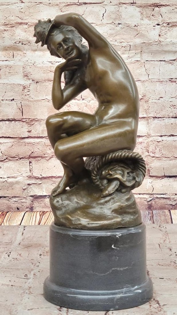 Seated Nude with Basket of Fish Inspired Bronze Sculpture - 15" x 6": Seated Nude with Basket of Fish Inspired Bronze Sculpture - 15" x 6" Inspired by the elegance of Jean-Baptiste Carpeaux, this exquisite bronze sculpture depicts a seated nude figure atop a ba