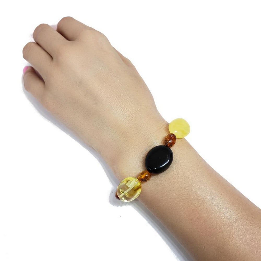 Multi-Color Genuine Authentic Baltic Amber Bracelet: Multi-Color Amber Stretch Bracelet. Butterscotch, cognac, cherry, and citrine color amber beads are set on an elastic cord. Genuine Baltic amber bracelet. Specifications WEIGHT-75-8.5 g COLOR-Multi-C