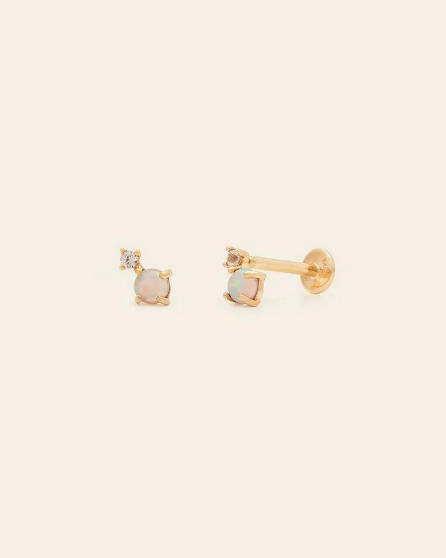 14k Solid Gold & Opalite Teardrop Stud Earrings: 14k Solid Gold & Opalite Teardrop Stud Earrings These 14K solid gold stud earrings feature luminous opalite teardrops, radiating a soft, ethereal glow. The minimalist gold setting enhances the