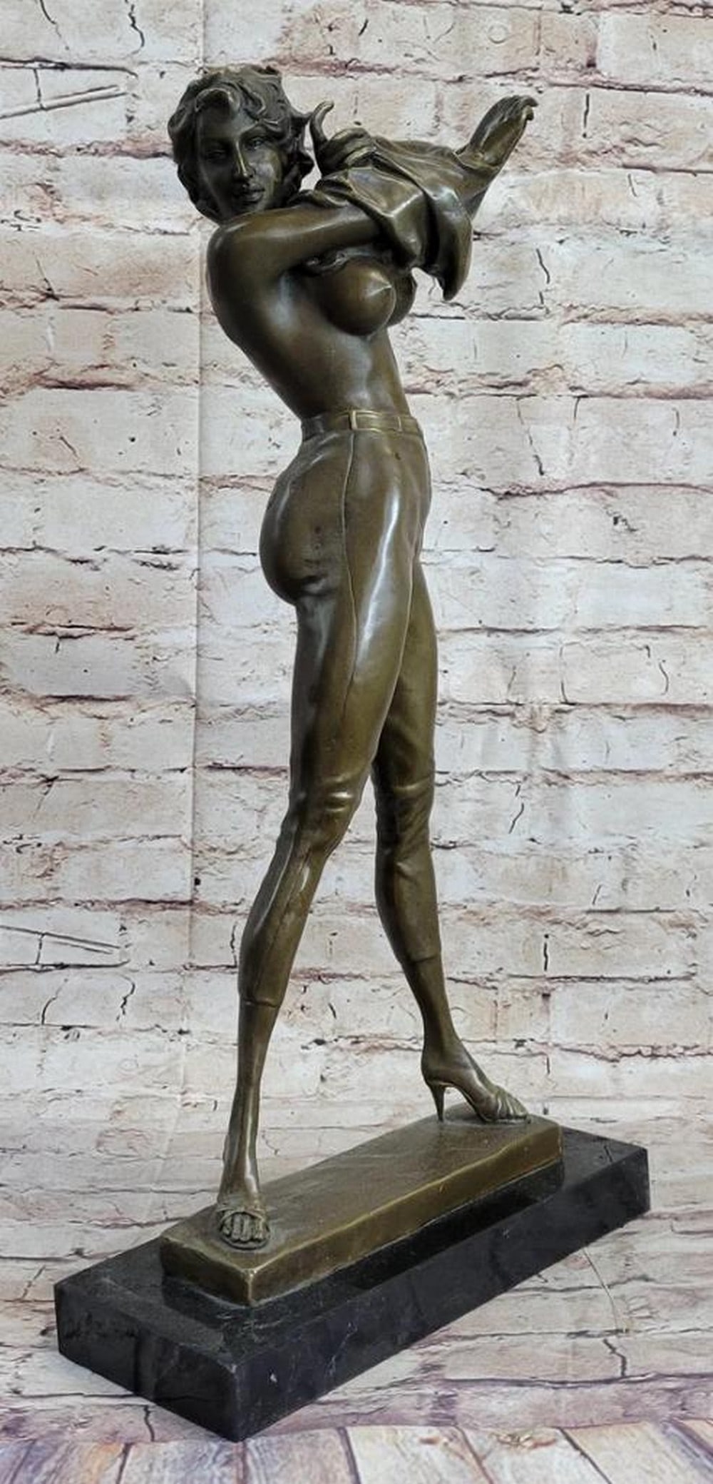 Confident Woman Removing Her Top Original Bronze Sculpture Signed by Aldo Vitaleh - 21.5" x 10.5": Confident Woman Removing Her Top Original Bronze Sculpture Signed by Aldo Vitaleh - 21.5" x 10.5" Experience the extraordinary with this bronze sculpture that captures the essence of a woman
