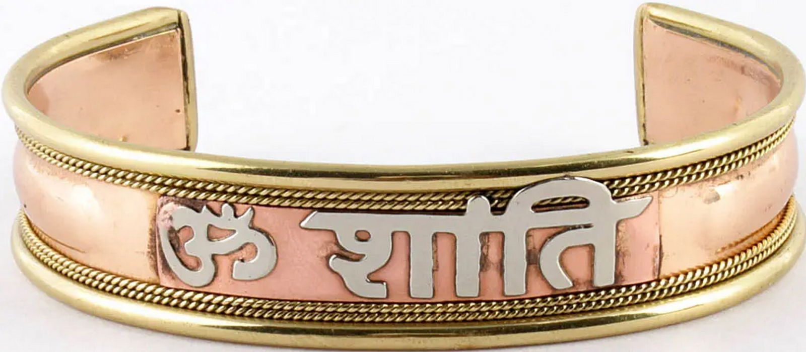 Om Shanti Bracelet: Om Shanti Bracelet This copper alloy bracelet features the sacred “Om” symbol followed by “Shanti,” meaning peace, set against a warm faux coral band. The elegant design combines