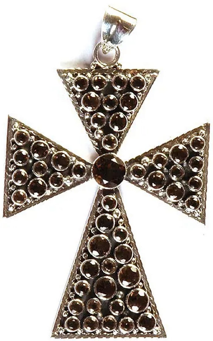 Twilight Smoky Quartz Cross: Twilight Smoky Quartz Cross The Twilight Smoky Quartz Cross pendant blends elegance with earthy mystique. Crafted from sterling silver, it features a faceted smoky quartz stone, radiating deep, warm