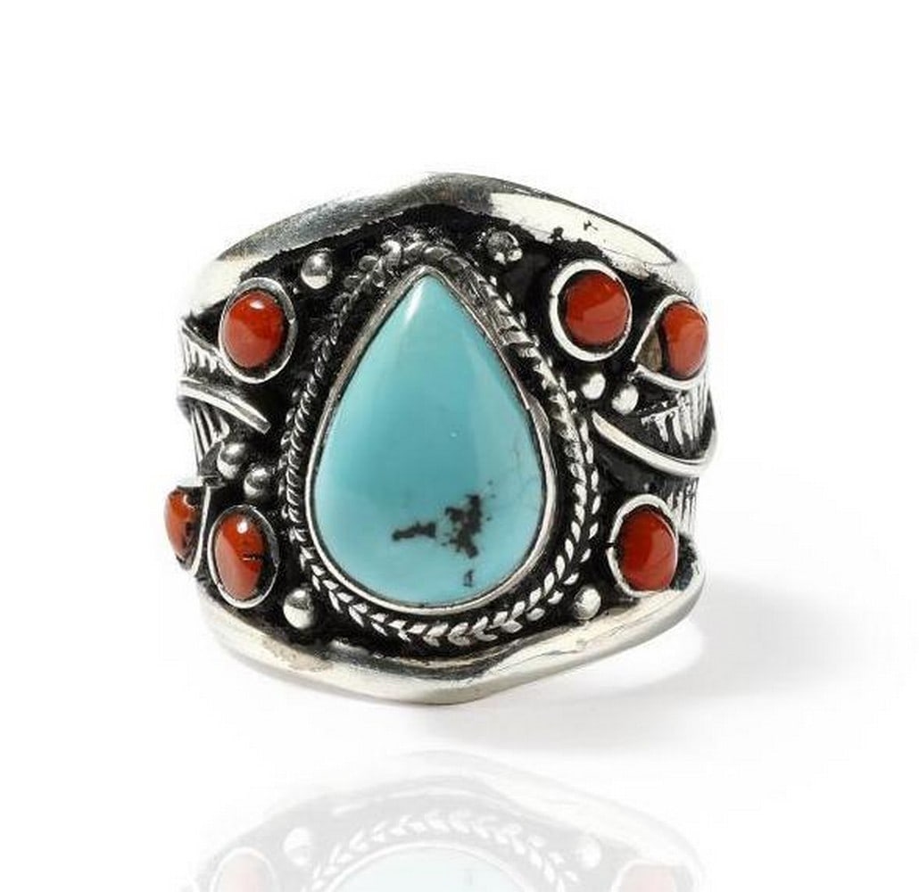 Turquoise Adjustable Ring with Coral Gemstones: Turquoise Adjustable Ring with Coral Gemstones This striking adjustable ring features a vibrant turquoise teardrop centerpiece accented with rich coral gemstones, set in intricately detailed
