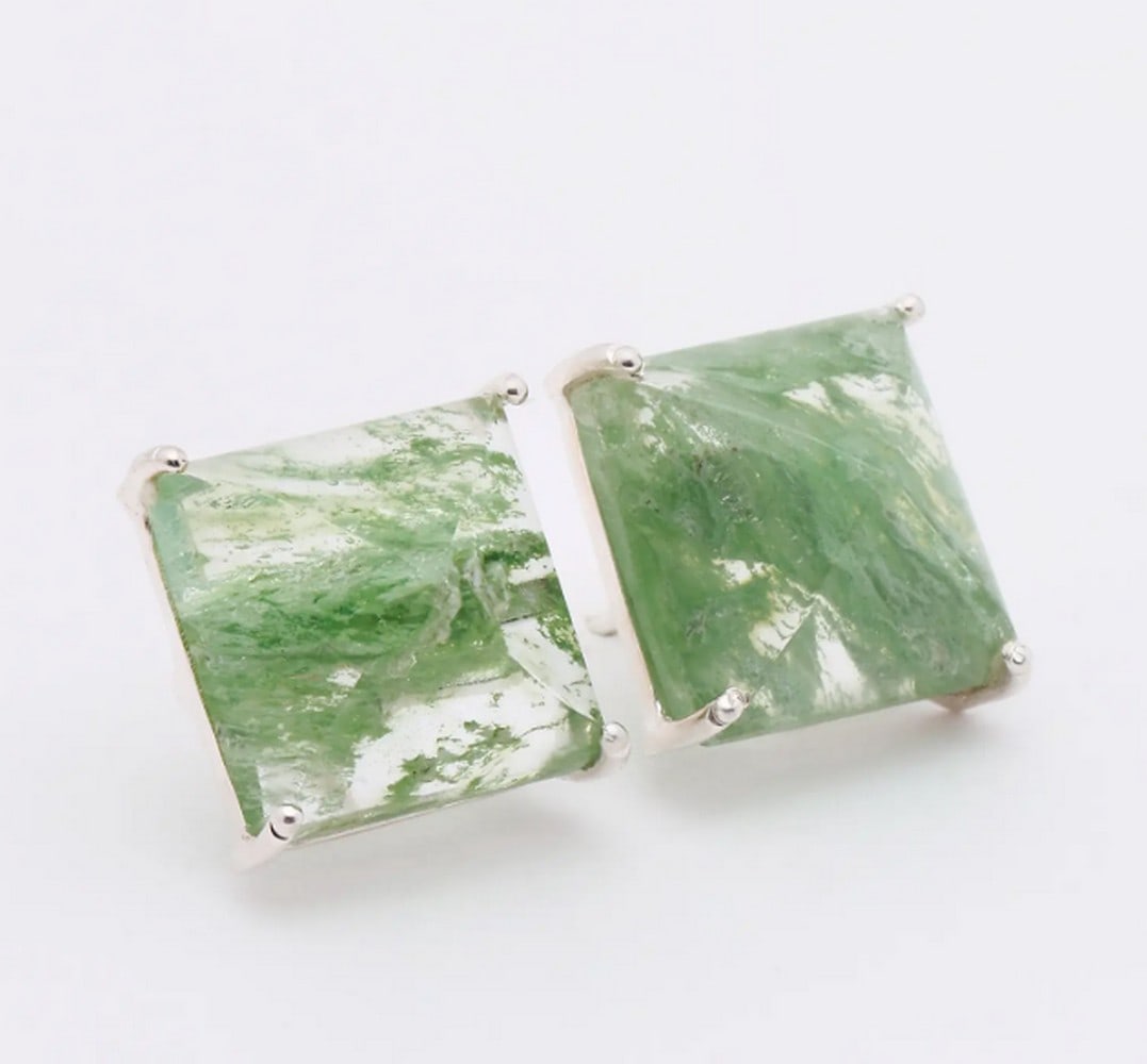 Ocean Mist Crackle Studs: Ocean Mist Crackle Studs These square-shaped stud earrings highlight the mesmerizing beauty of aqua crackle gemstones. Their unique texture creates a captivating play of light and shadow, enhanced