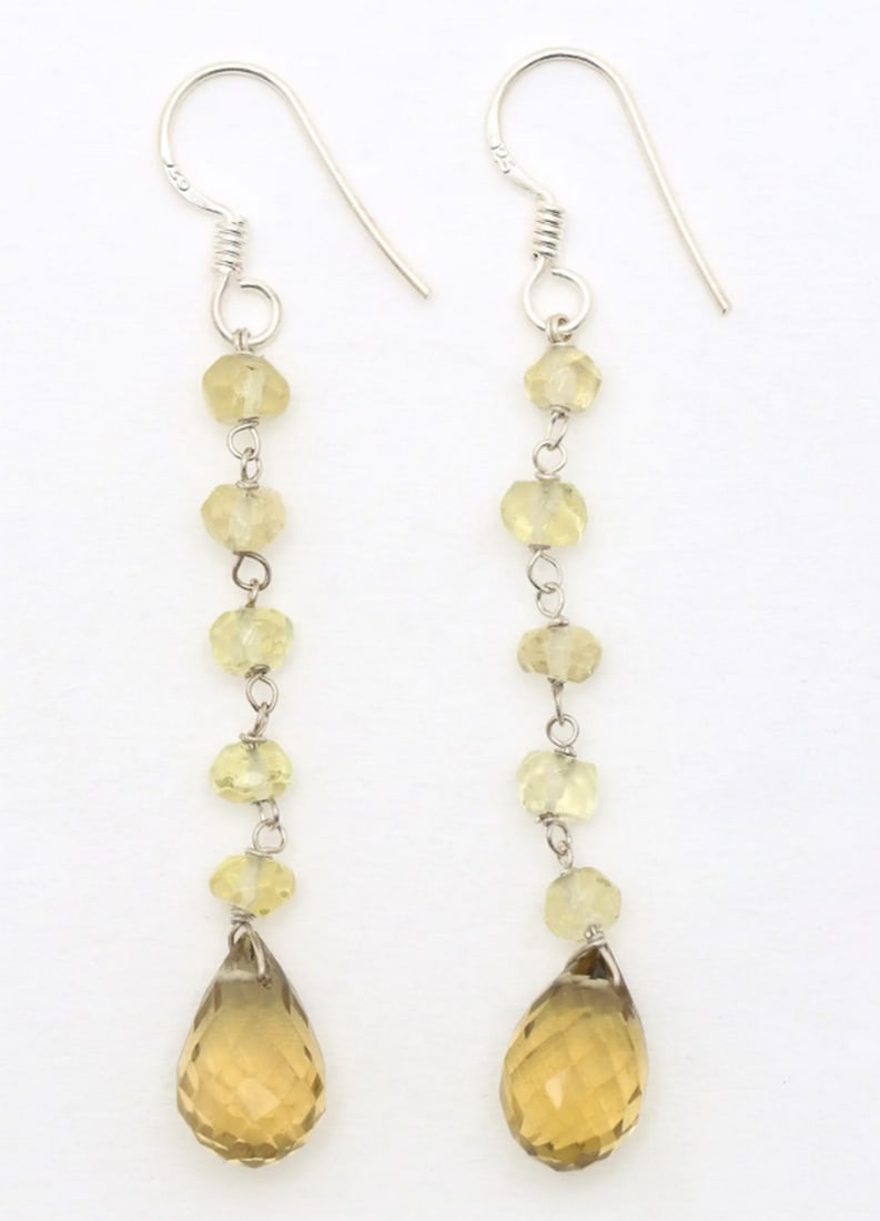 Divine Krishna Teardrop Drops: Divine Krishna Teardrop Drops These teardrop-shaped sterling silver earrings feature a hand-painted miniature of Lord Krishna, blending artistry and spirituality. Vibrant colors and intricate