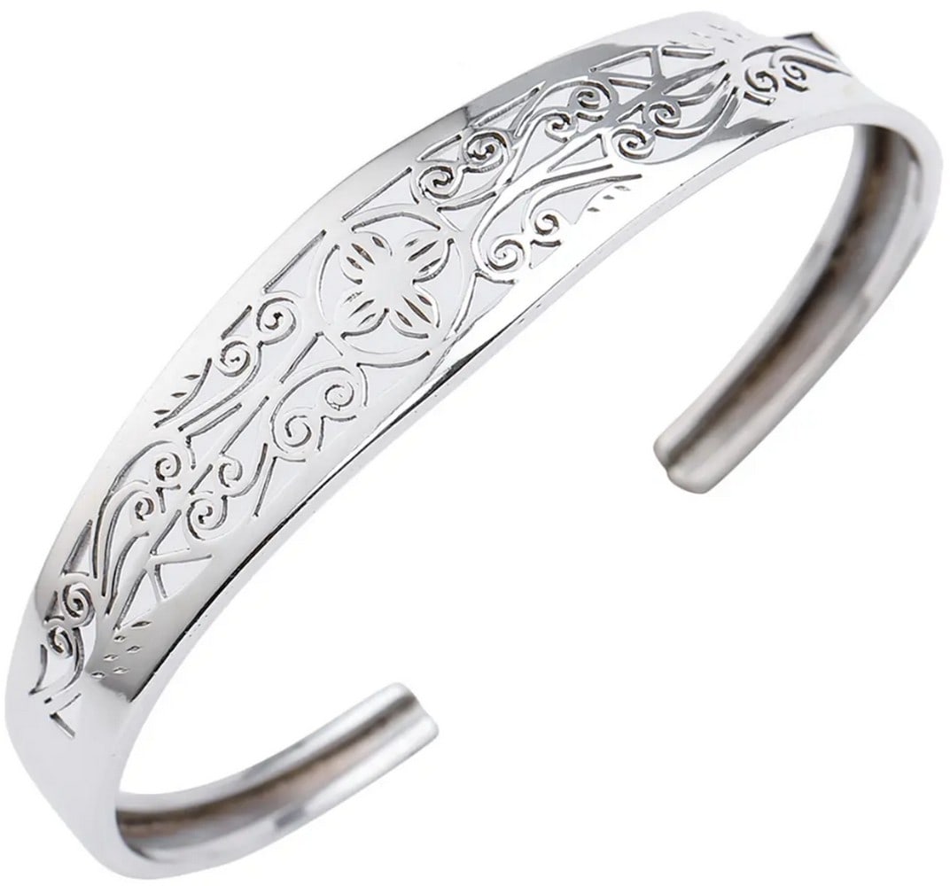Adjustable Sterling Silver Jali Cut Cuff Bracelet: Adjustable Sterling Silver Jali Cut Cuff Bracelet This beautifully crafted sterling silver cuff showcases intricate jali cut patterns inspired by Nepalese artistry. Lightweight and adjustable for