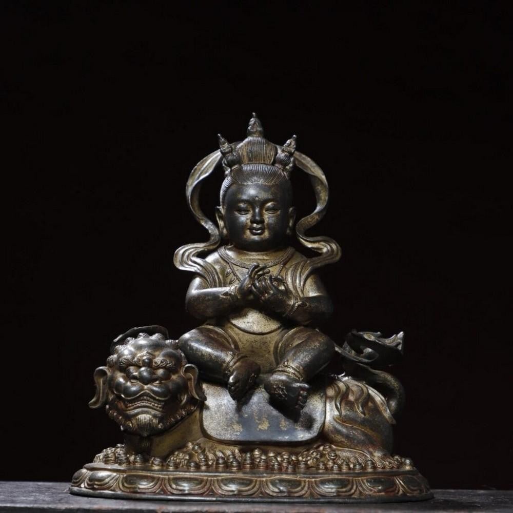 Boy Riding Animal Buddha Statue: Boy Riding Animal Buddha Statue This rare and exquisite statue features a boy riding an animal, skillfully handcrafted from pure copper. The detailed craftsmanship brings life to this unique scene, sy