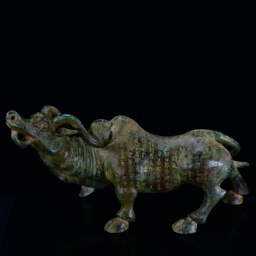 Antique Bronze Bull with Silver Inlay: Antique Bronze Bull with Silver Inlay This impressive Chinese antique features a large hand-crafted bronze bull adorned with intricate silver inlay. Symbolizing strength, prosperity, and