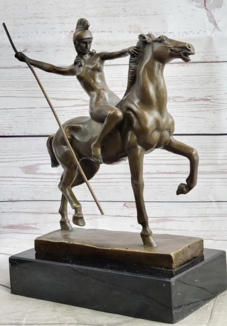 Amazon Warrior Princess: Nude Woman on Horseback Bronze Sculpture: Amazon Warrior Princess: Nude Woman on Horseback Bronze Sculpture Bold and commanding, this striking bronze sculpture depicts a nude Amazon warrior princess riding confidently on horseback. Wearing o