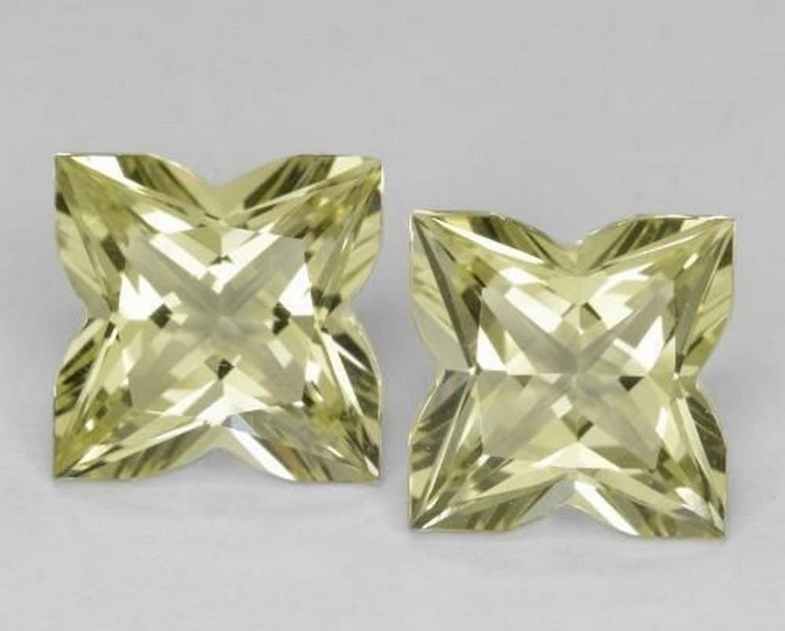 8.02 ct Natural Medium Yellow Quartz Pair, Fancy Cut, VVS: 8.02 ct Natural Medium Yellow Quartz Pair, Fancy Cut, VVS Natural quartz pair weighing a total of 8.02 carats, fashioned in a fancy cut with a medium yellow color. The gems measure 10.01 x 10.00 x 6.8