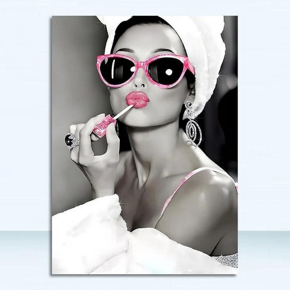 Glow On the Go Picture: Glow On the Go Picture. In this delightful moment, a woman embraces her morning routine with playful elegance, applying a vibrant pink lipstick while her hair is stylishly wrapped in a towel. This