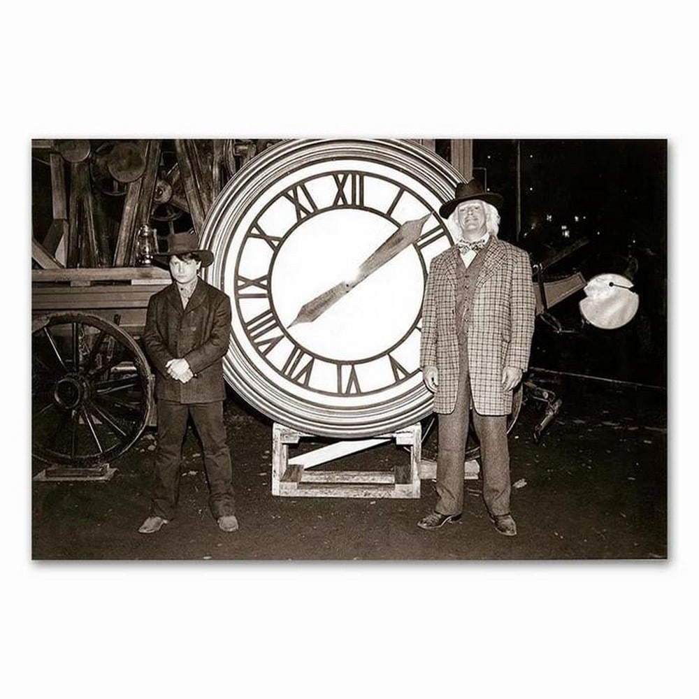 Back To The Future Picture: Back To The Future Picture. This dynamic picture captures the iconic duo, Doc Brown and Marty McFly, from Back to the Future, standing with the famous Hill Valley clock tower centered between them. T