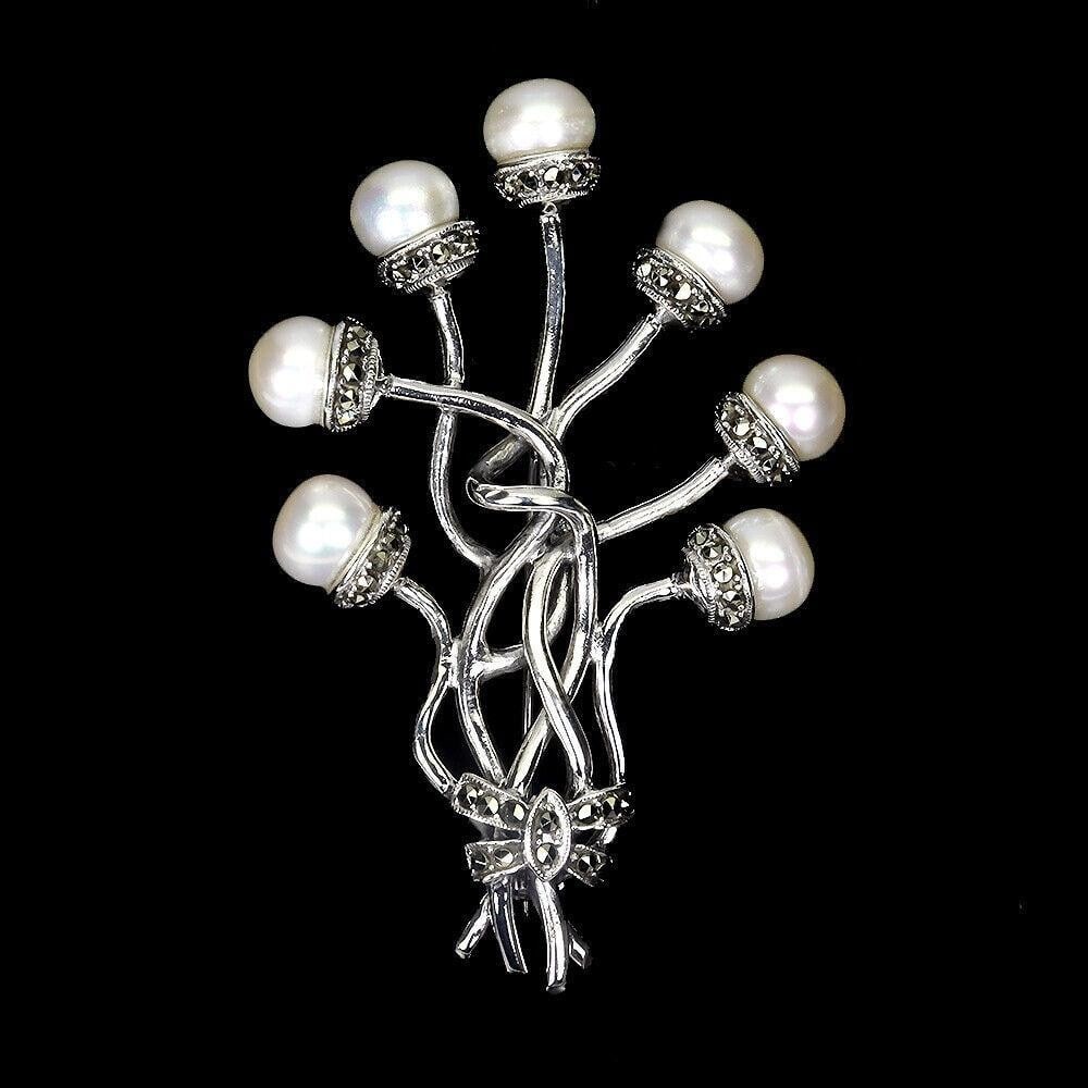 Natural Round Creamy White Pearl & Marcasite Sterling Silver Brooch: Natural Round Creamy White Pearl & Marcasite Sterling Silver Brooch Add a touch of classic elegance with the Natural Round Creamy White Pearl & Marcasite Sterling Silver Brooch. This