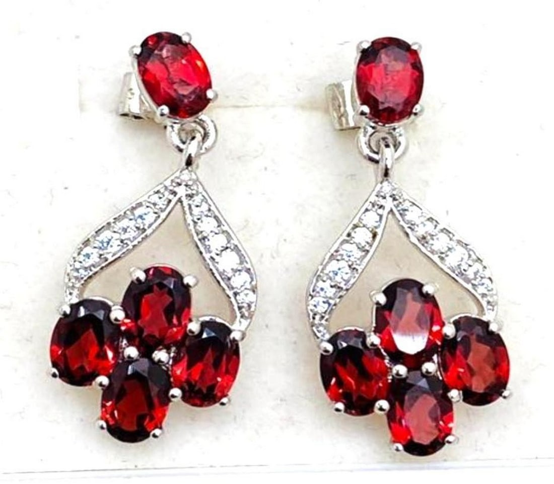 Red Garnet Stone Cluster Dangle Earrings: Red Garnet Stone Cluster Dangle Earrings These ravishing red garnet earrings are 925 Sterling Silver. They feature a cluster of 4 stones dangling from a stone on the front of the stud. View Photos F