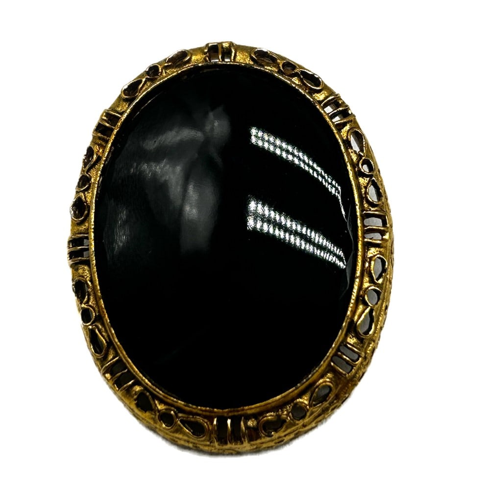 Simplistic Black and Gold Accent Brooch: Simplistic Black and Gold Accent Brooch This minimalist yet striking brooch features a classic black enamel face adorned with delicate gold accents, creating a captivating contrast that