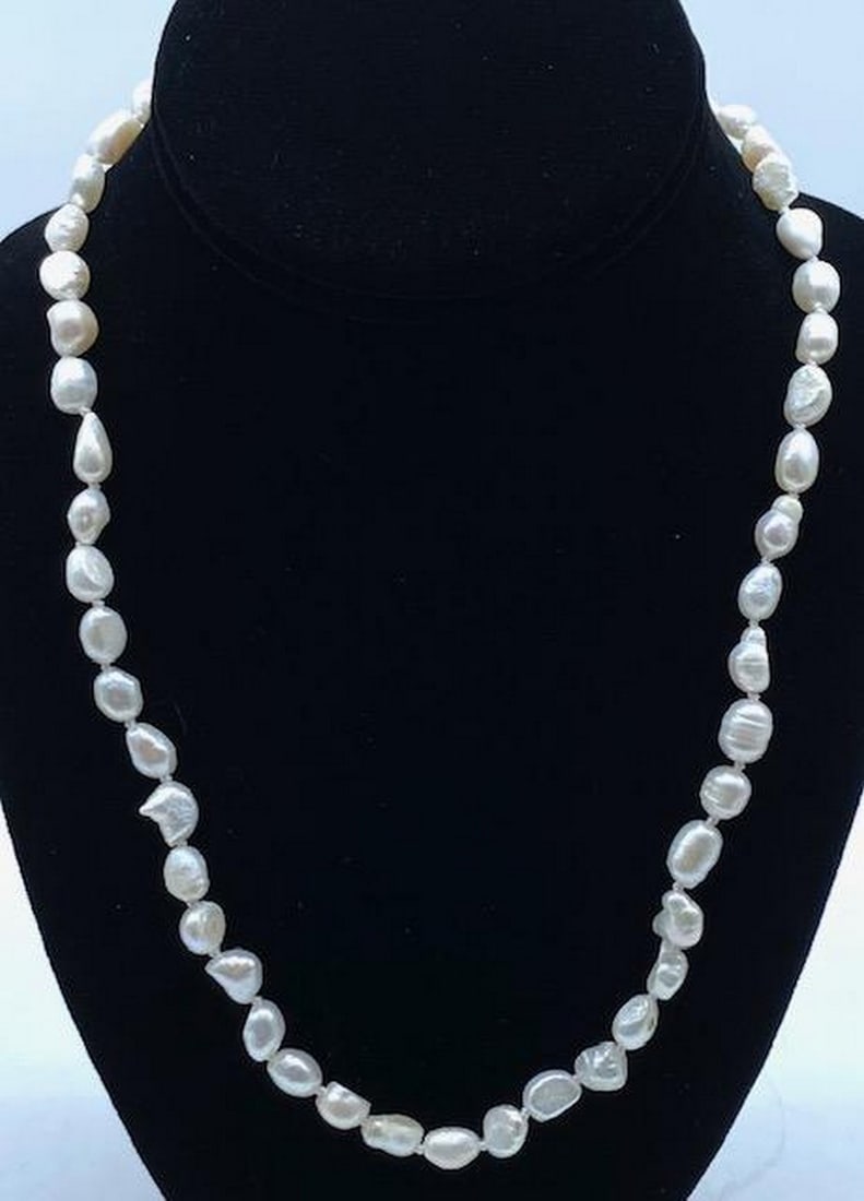 20" Genuine 7mm-8mm White Baroque Cultured Pearl Necklace: 20" Genuine 7mm-8mm White Baroque Cultured Pearl Necklace. A Striking White Luster Comes From Each Of The Baroque Pearls On This Hand Made Necklace. Necklace Length: 20" Inches Pearl